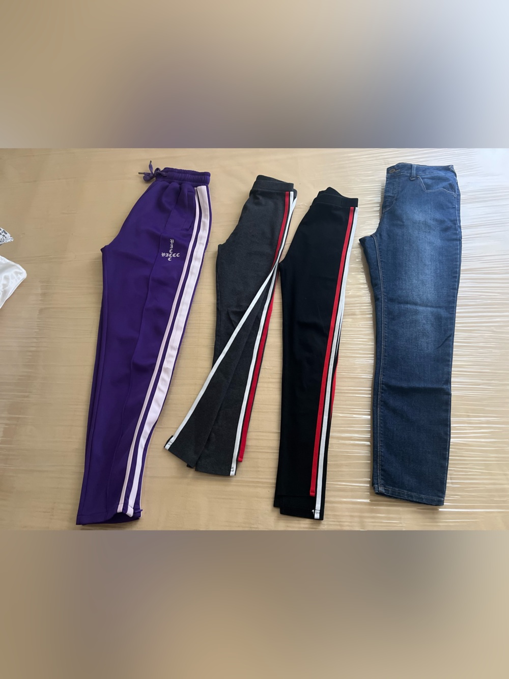 4 These purple and black striped track pants and classic denim jeans offer a ver
